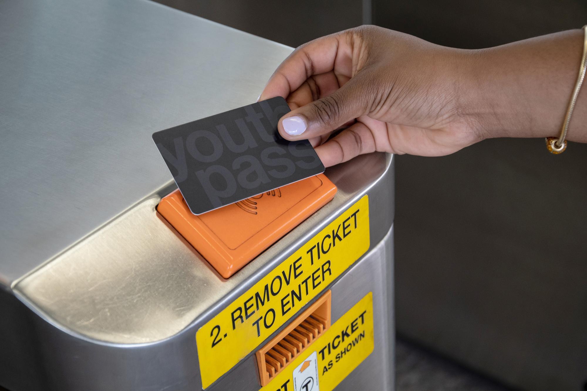 Tapping a Youth Pass on a subway fare gate