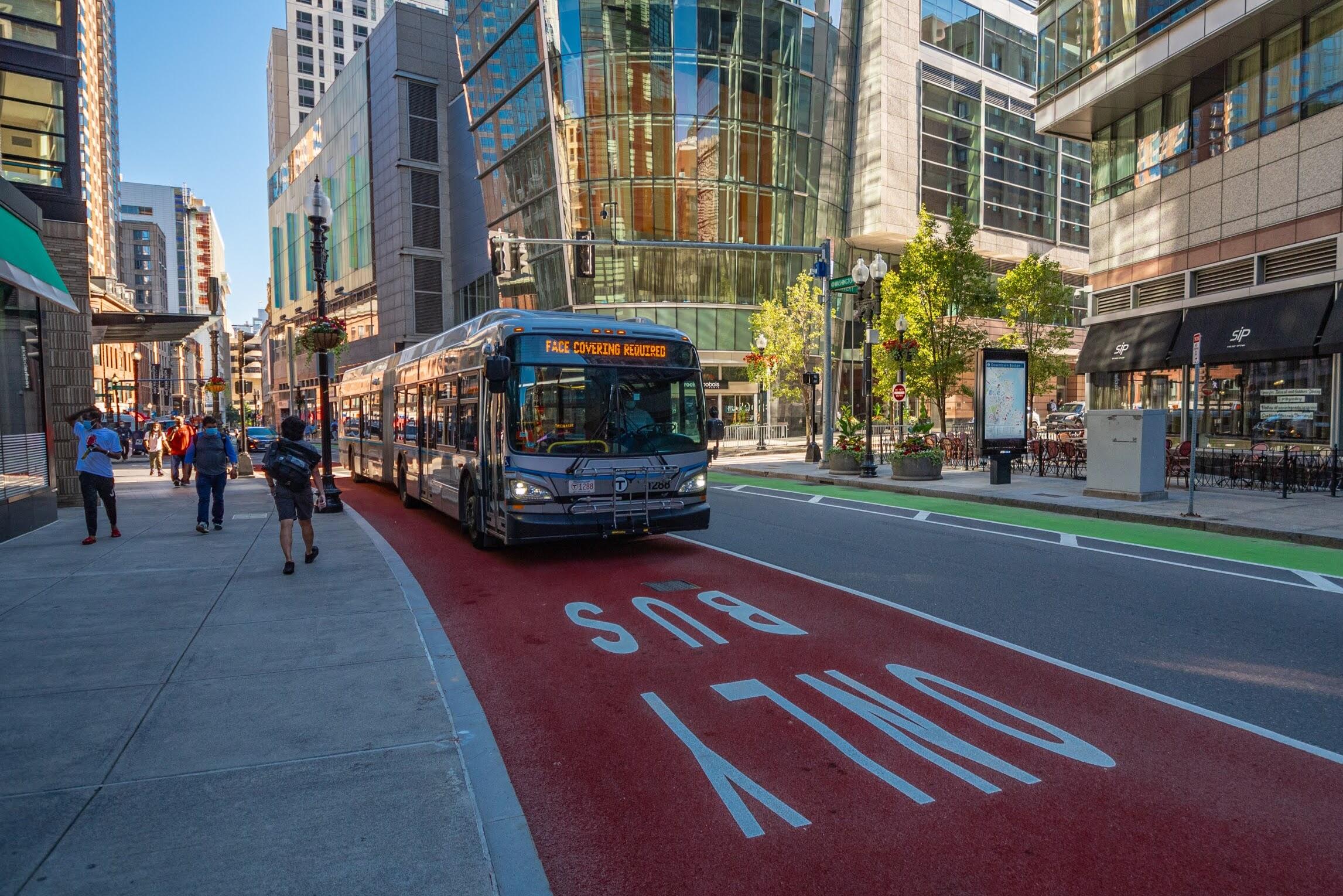 Silver Line bus in a bus lane along Washington St in Downton Boston, with a headsdign that reads 