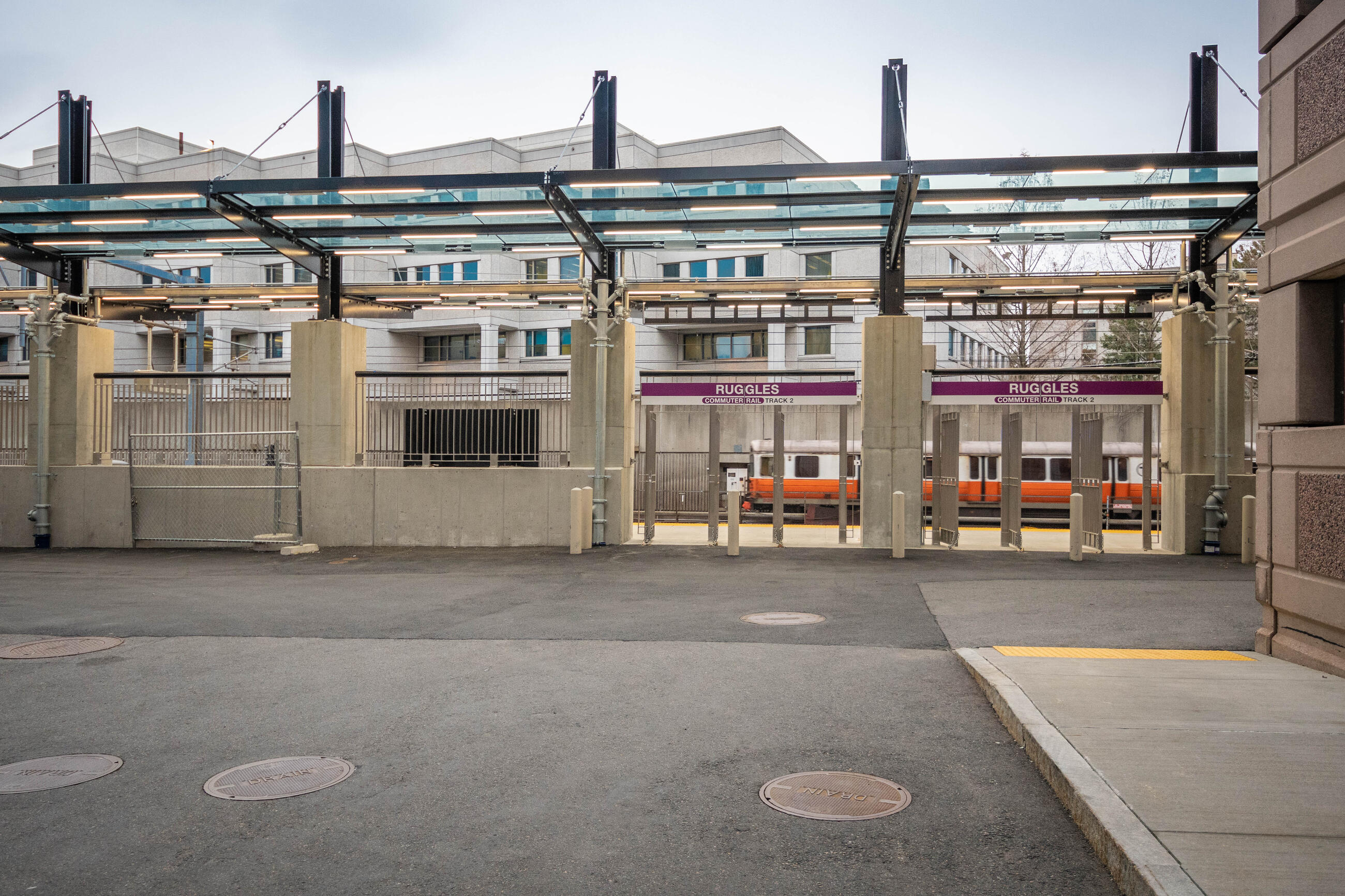 Commuter Rail platform at Ruggles with an Orange Line car in the background