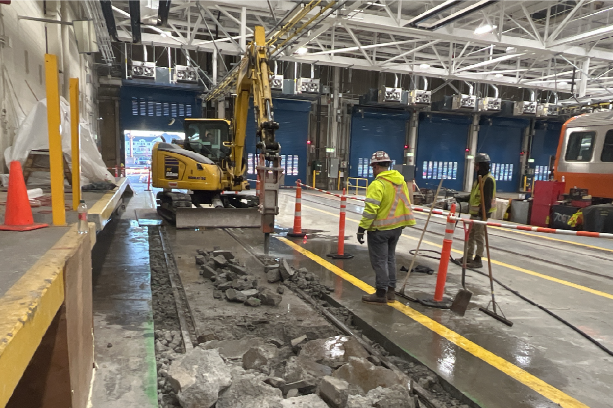 crew using machinery to cut up concrete flooring 