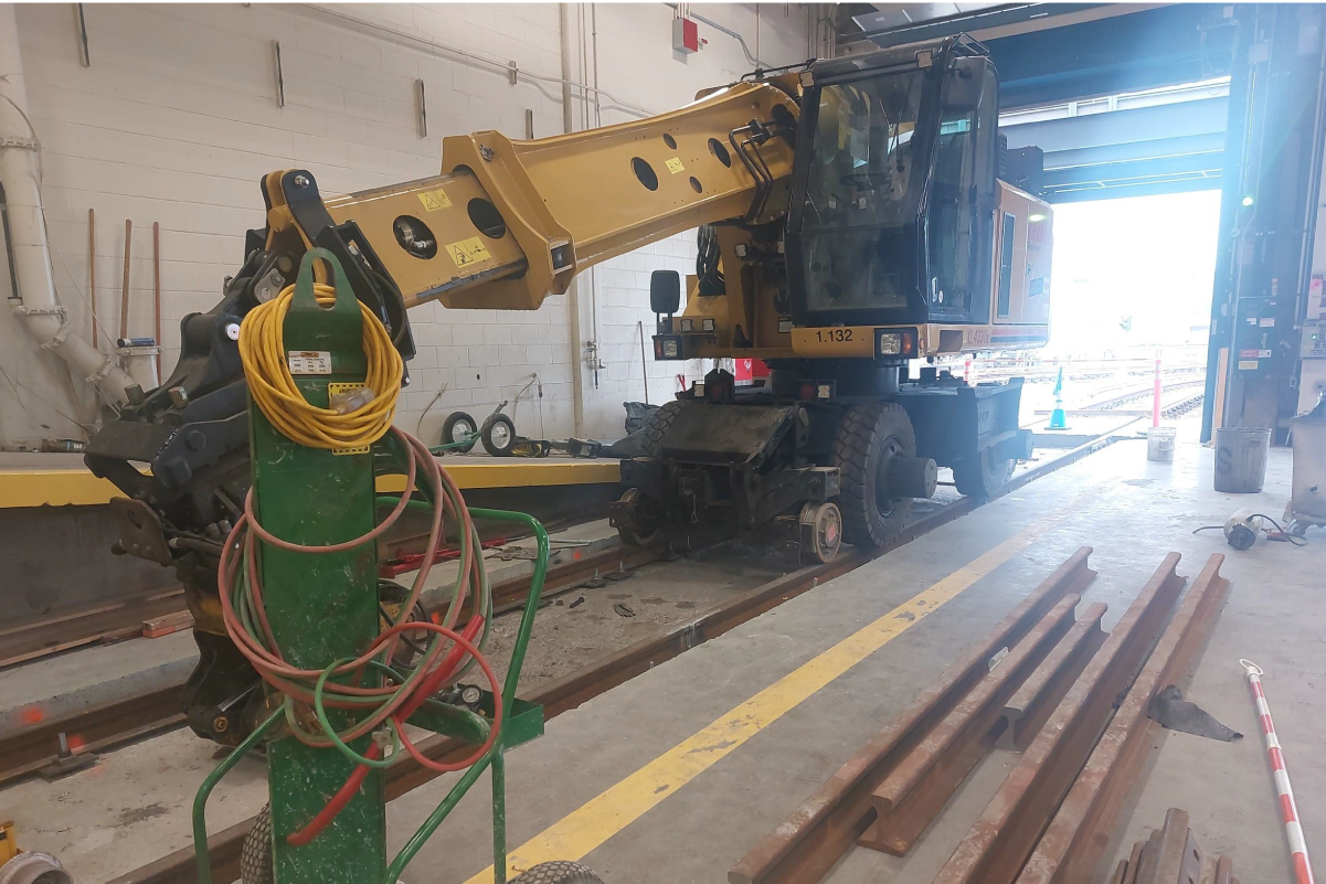 a photo of construction equipment inside a warehouse type facility