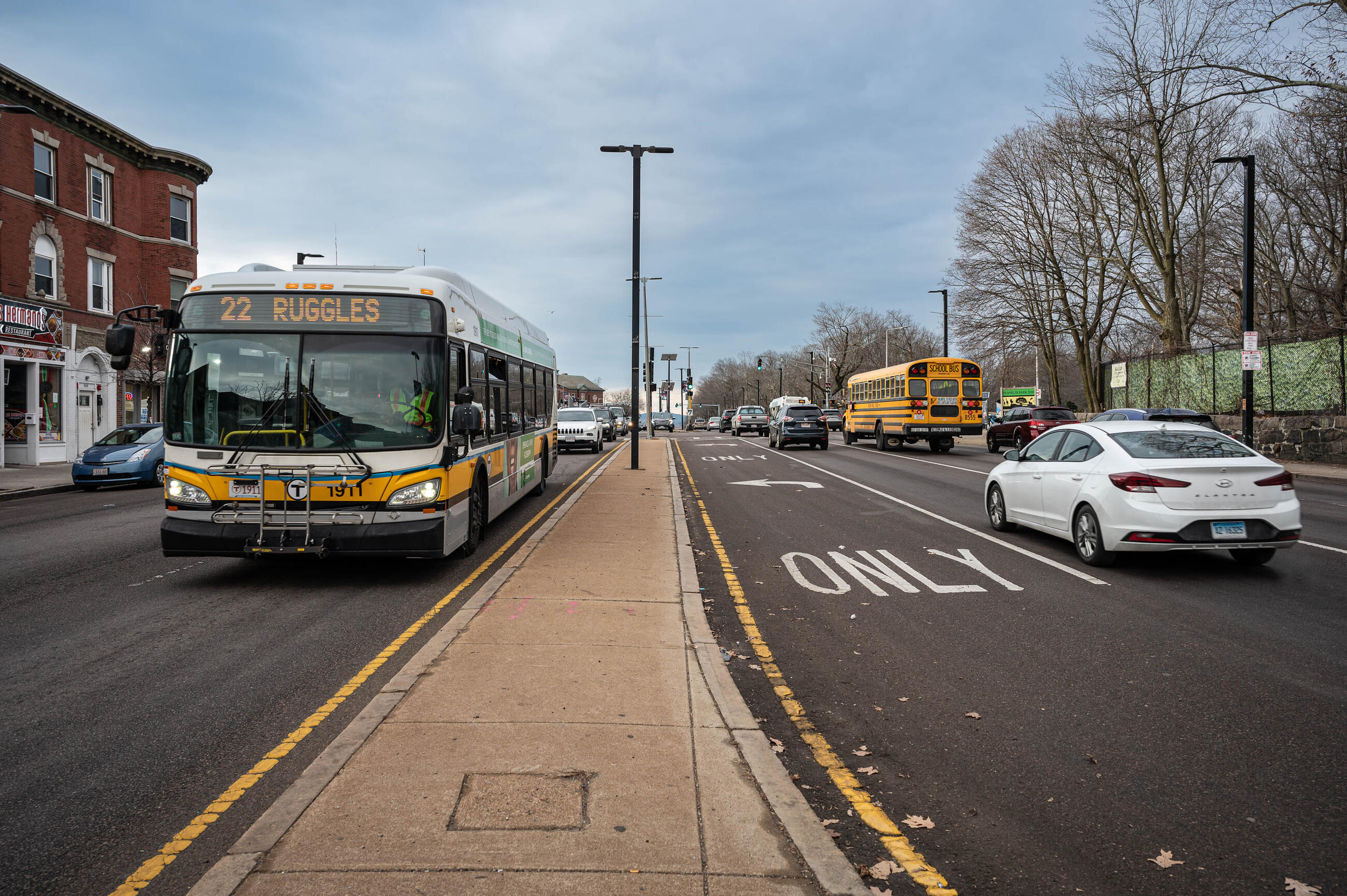 bus driving down blue hill avenue